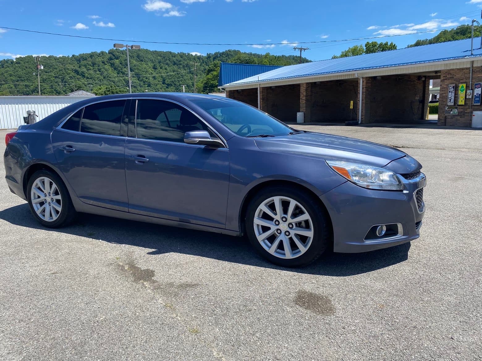 Professional exterior wash and detailing on a grey sedan in Paintsville, KY
